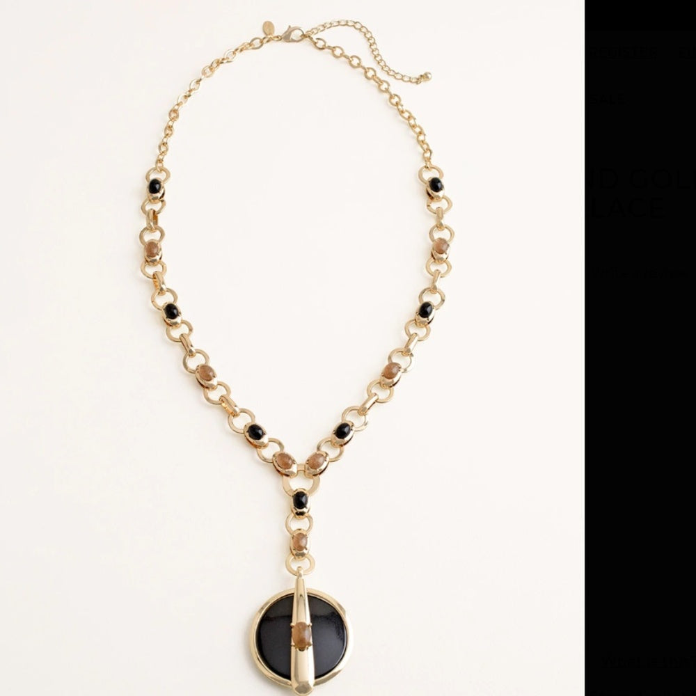 LONG BLACK AND GOLD-TONE PENDANT NECKLACE